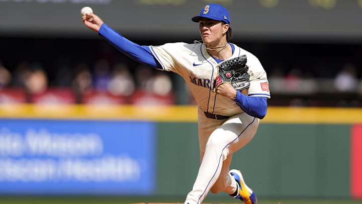 Seattle Mariners starting pitcher Bryan Woo throws during a game against the Athletics on March 30 at T-Mobile Park. Seattle Mariners starting pitcher Bryan Woo throws during a game against the Athletics on March 30 at T-Mobile Park.