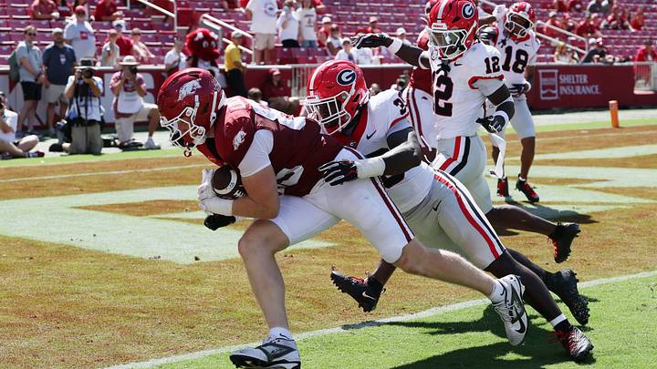 Sep 19, 2026; Fayetteville, Arkansas, USA;  Arkansas Razorbacks tight end Ty Lockwood (85) dives for a touchdown against the Georgia Bulldogs Georgia Bulldogs linebacker Terrell Foster (30) during the second half at Donald W. Reynolds Razorback Stadium.  Mandatory Credit: Nelson Chenault-Imagn Images