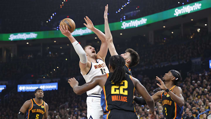 May 5, 2025; Oklahoma City, Oklahoma, USA; Denver Nuggets center Nikola Jokic (15) shoots against Oklahoma City Thunder forward Chet Holmgren (7) during the second quarter in Game 1 of the second round at Paycom Center. Mandatory Credit: Alonzo Adams-Imagn Images