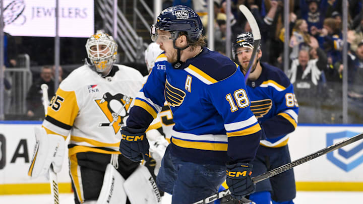 Apr 3, 2025; St. Louis, Missouri, USA;  St. Louis Blues center Robert Thomas (18) reacts after scoring the game winning goal against Pittsburgh Penguins goaltender Tristan Jarry (35) during overtime at Enterprise Center. Mandatory Credit: Jeff Curry-Imagn Images