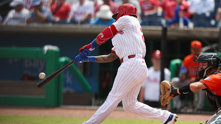Mar 9, 2025; Clearwater, Florida, USA; Philadelphia Phillies shortstop Edmundo Sosa (33) hits a solo home run against the Baltimore Orioles in the third inning during spring training.