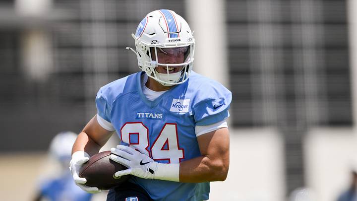Jun 16, 2026; Nashville, TN, USA;  Tennessee Titans tight end Gunnar Helm (84) runs with the ball after a made catch during day 1 of mini-camp at Vanderbilt Health Football Center. Mandatory Credit: Steve Roberts-Imagn Images