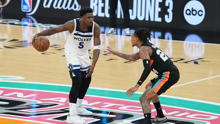 May 4, 2026; San Antonio, Texas, USA; Minnesota Timberwolves guard Anthony Edwards (5) dribbles against San Antonio Spurs guard Devin Vassell (24) in the second half during game one of the second round of the 2026 NBA Playoffs at Frost Bank Center. Mandatory Credit: Daniel Dunn-Imagn Images