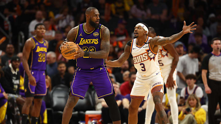 Oct 28, 2024; Phoenix, Arizona, USA; Los Angeles Lakers forward LeBron James (23) against Phoenix Suns guard Bradley Beal (3) at Footprint Center. Mandatory Credit: Mark J. Rebilas-Imagn Images