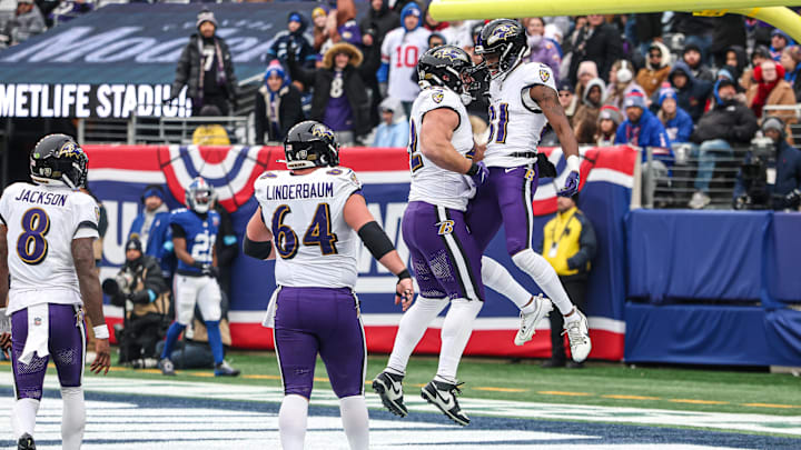 Dec 15, 2024; East Rutherford, New Jersey, USA; Baltimore Ravens wide receiver Devontez Walker (81) celebrates his touchdown with teammates during the second half against the New York Giants at MetLife Stadium. Mandatory Credit: Vincent Carchietta-Imagn Images