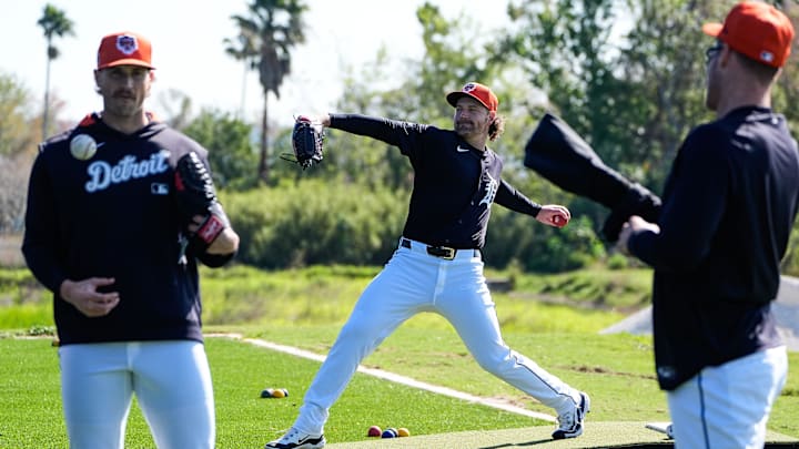 Detroit Tigers pitcher Dietrich Enns, center, warms up next to pitchers Sawyer Gipson-Long, left, and Matt Manning during spring training at TigerTown in Lakeland, Fla. on Friday, Feb. 21, 2025.