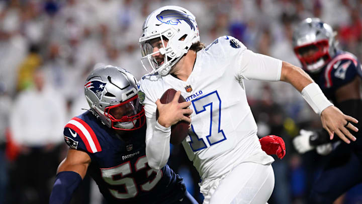Oct 5, 2025; Orchard Park, New York, USA; Buffalo Bills quarterback Josh Allen (17) rushes the ball past New England Patriots linebacker Christian Elliss (53)