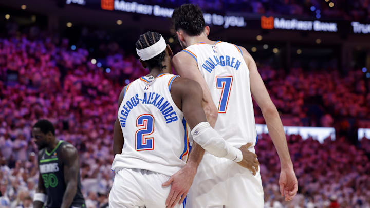 May 20, 2025; Oklahoma City, Oklahoma, USA; Oklahoma City Thunder guard Shai Gilgeous-Alexander (2) and forward Chet Holmgren (7) react after a play in the fourth quarter against the Minnesota Timberwolves during game one of the western conference finals for the 2025 NBA Playoffs at Paycom Center. Mandatory Credit: Alonzo Adams-Imagn Images