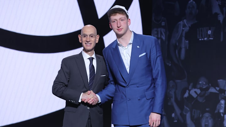 Jun 25, 2025; Brooklyn, NY, USA; Danny Wolf stands with NBA commissioner Adam Silver after being selected as the 27th pick by the Brooklyn Nets in the first round of the 2025 NBA Draft at Barclays Center. Mandatory Credit: Brad Penner-Imagn Images Jun 25, 2025; Brooklyn, NY, USA; Danny Wolf stands with NBA commissioner Adam Silver after being selected as the 27th pick by the Brooklyn Nets in the first round of the 2025 NBA Draft at Barclays Center. Mandatory Credit: Brad Penner-Imagn Images