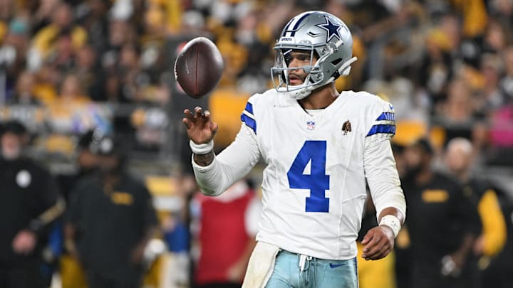 Oct 6, 2024; Pittsburgh, Pennsylvania, USA; Dallas Cowboys quarterback Dak Prescott (4) spins the ball between plays against the Pittsburgh Steelers during the fourth quarter at Acrisure Stadium.