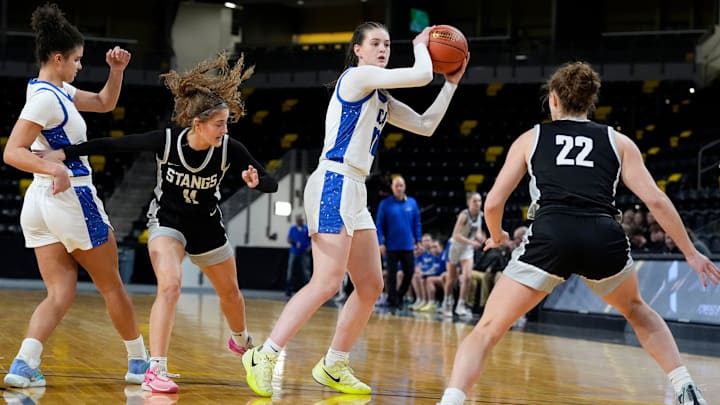Clear Creek Amana's Averie Lower (10) looks to pass against the Mount Vernon Mustangs during a girls basketball game Tuesday, Feb. 11, 2025 at Xtream Arena in Coralville, Iowa.