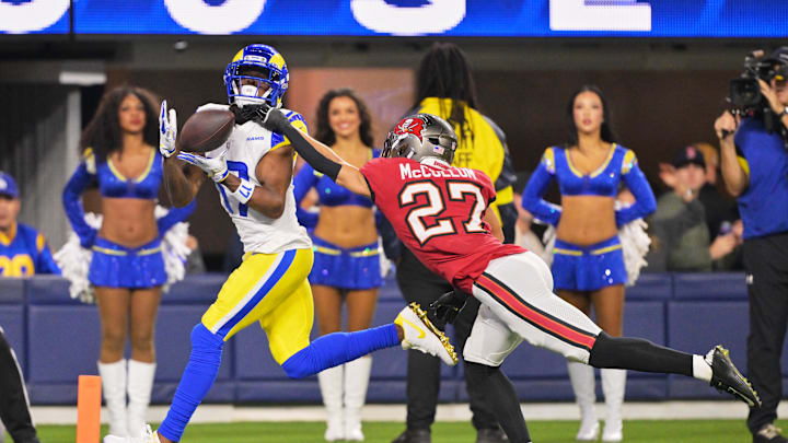 Nov 23, 2025; Inglewood, California, USA; Los Angeles Rams wide receiver Davante Adams (17) catches a twenty-four touchdown pass thrown by quarterback Matthew Stafford (not pictured) against Tampa Bay Buccaneers cornerback Zyon McCollum (27) during the second quarter at SoFi Stadium.  Mandatory Credit: Jayne Kamin-Oncea-Imagn Images