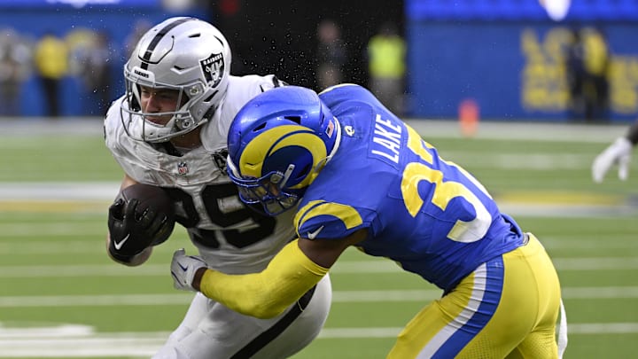 Oct 20, 2024; Inglewood, California, USA; Los Angeles Rams safety Quentin Lake (37) stops Las Vegas Raiders tight end Brock Bowers (89) after a catch in the second half at SoFi Stadium. Mandatory Credit: Alex Gallardo-Imagn Images Oct 20, 2024; Inglewood, California, USA; Los Angeles Rams safety Quentin Lake (37) stops Las Vegas Raiders tight end Brock Bowers (89) after a catch in the second half at SoFi Stadium. Mandatory Credit: Alex Gallardo-Imagn Images