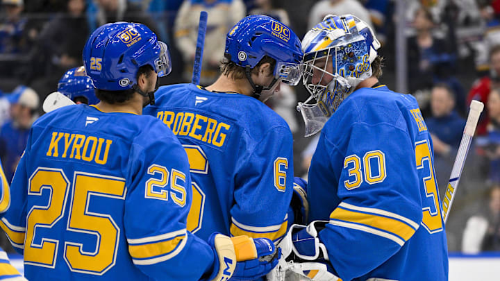 Mar 22, 2025; St. Louis, Missouri, USA;  St. Louis Blues goaltender Joel Hofer (30) and defenseman Philip Broberg (6) celebrate after the Blues defeated the Chicago Blackhawks at Enterprise Center. Mandatory Credit: Jeff Curry-Imagn Images