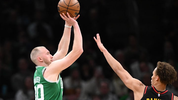 Jan 28, 2026; Boston, Massachusetts, USA; Boston Celtics forward Sam Hauser (30) attempts a basket against Atlanta Hawks guard Dyson Daniels (5) during the first half at the TD Garden. Mandatory Credit: Brian Fluharty-Imagn Images