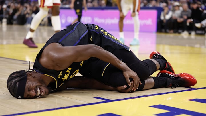 Jan 19, 2026; San Francisco, California, USA; Golden State Warriors forward Jimmy Butler III (10) holds his right knee as he goes down with an injury during the third quarter against the Miami Heat at Chase Center. Mandatory Credit: Kelley L Cox-Imagn Images