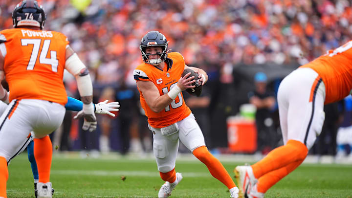 Oct 27, 2024; Denver, Colorado, USA; Denver Broncos quarterback Bo Nix (10) scrambles with the ball in the first half against the Carolina Panthers at Empower Field at Mile High. Mandatory Credit: Ron Chenoy-Imagn Images Oct 27, 2024; Denver, Colorado, USA; Denver Broncos quarterback Bo Nix (10) scrambles with the ball in the first half against the Carolina Panthers at Empower Field at Mile High. Mandatory Credit: Ron Chenoy-Imagn Images