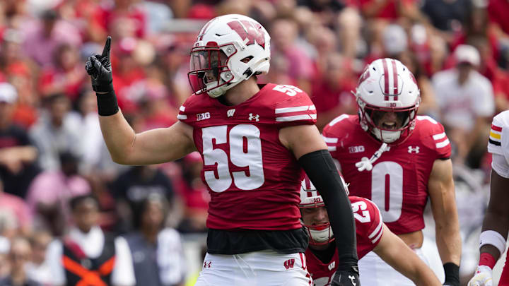Sep 20, 2025; Madison, Wisconsin, USA;  Wisconsin Badgers linebacker Aaron Witt (59) celebrates following a tackle during the second quarter against the Maryland Terrapins at Camp Randall Stadium. Mandatory Credit: Jeff Hanisch-Imagn Images
