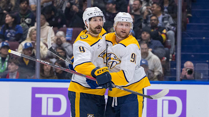 Nov 17, 2024; Vancouver, British Columbia, CAN; Nashville Predators forward Filip Forsberg (9) and forward Steven Stamkos (91) celebrate Stamkos’ second goal against the Vancouver Canucks during the second period at Rogers Arena. Mandatory Credit: Bob Frid-Imagn Images