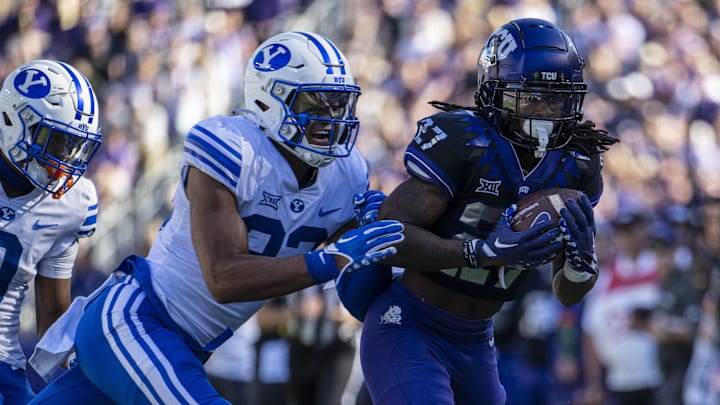 Oct 14, 2023; Fort Worth, Texas, USA; TCU Horned Frogs wide receiver Jordyn Bailey (27) catches a pass for a first down as Brigham Young Cougars safety Raider Damuni (33) defends during the game at Amon G. Carter Stadium. Mandatory Credit: Jerome Miron-Imagn Images