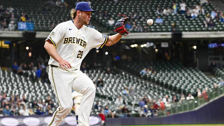 Apr 30, 2026; Milwaukee, Wisconsin, USA;  Milwaukee Brewers pitcher Trevor Megill (29) makes the out on a groundball by Arizona Diamondbacks center fielder Alek Thomas (not pictured) in the seventh inning at American Family Field. Mandatory Credit: Benny Sieu-Imagn Images