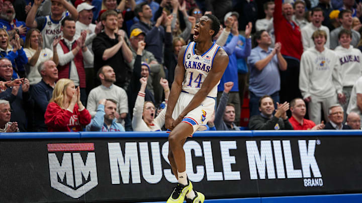 Kansas Jayhawks guard Melvin Council Jr. (14) plays with joy