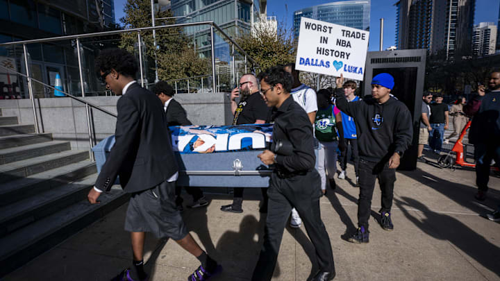 Mavericks fans walk to the arena with a coffin during a mock funeral before the game between the Dallas Stars and the Columbus Blue Jackets. 