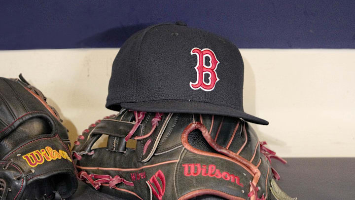 May 27, 2025; Milwaukee, Wisconsin, USA; A Boston Red Sox hat and glove sit in the dug out before a game against the Milwaukee Brewers at American Family Field. Mandatory Credit: Michael McLoone-Imagn Images May 27, 2025; Milwaukee, Wisconsin, USA; A Boston Red Sox hat and glove sit in the dug out before a game against the Milwaukee Brewers at American Family Field. Mandatory Credit: Michael McLoone-Imagn Images