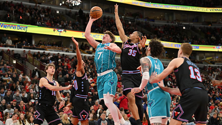 Jan 3, 2026; Chicago, Illinois, USA; Charlotte Hornets guard Kon Knueppel (7) goes up for a shot against Chicago Bulls forward Matas Buzelis (14), guard Tre Jones (30) and forward Isaac Okoro (35) during the first half at United Center. Mandatory Credit: Patrick Gorski-Imagn Images