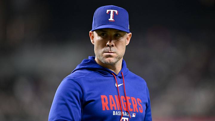 Texas Rangers manager Skip Schumaker walks back to the dugout.