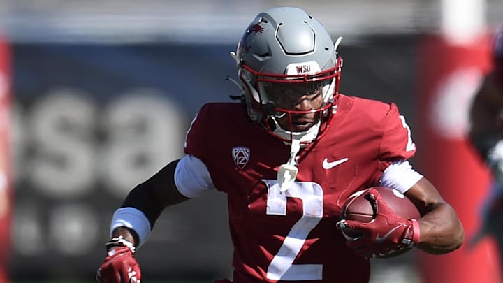 Aug 31, 2024; Pullman, Washington, USA; Washington State Cougars wide receiver Kyle Williams (2) carries the ball against the Portland State Vikings in the second half at Gesa Field at Martin Stadium. Mandatory Credit: James Snook-USA TODAY Sports