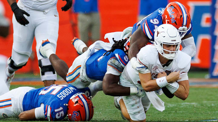 Florida Gators defensive end Tyreak Sapp and linebacker Myles Graham sack Texas Longhorns quarterback Arch Manning