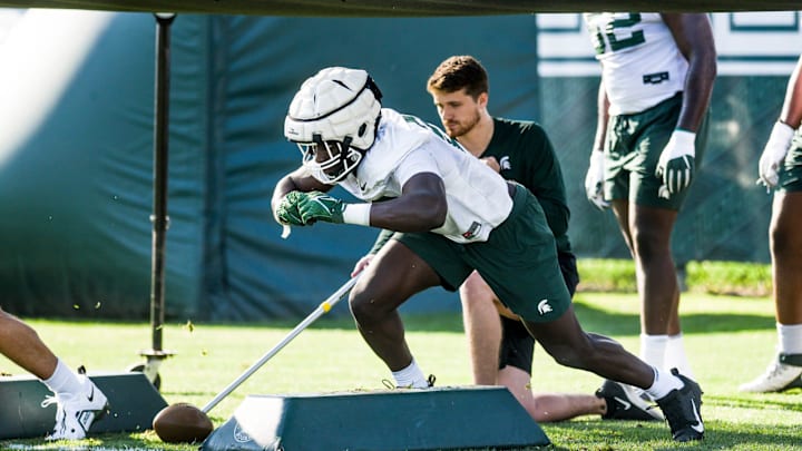 Michigan State linebacker Bai Jobe runs a drill during the opening day of MSU's football fall camp