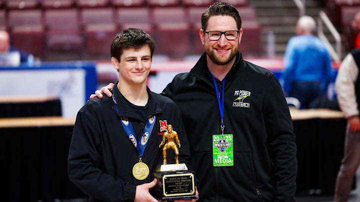 Bishop McCort junior Jax Forrest receives the Robert W. Craig Outstanding Wrestler Award during the PIAA state AA wrestling championships, Saturday, March 8, 2025, at the Giant Center in Hershey.