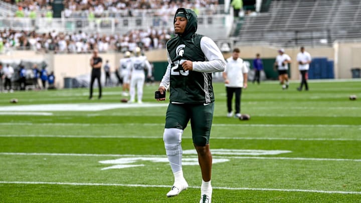 Michigan State's Darius Snow warms up on the field before the game against Washington on Saturday, Sept. 16, 2023, at Spartan Stadium in East Lansing.