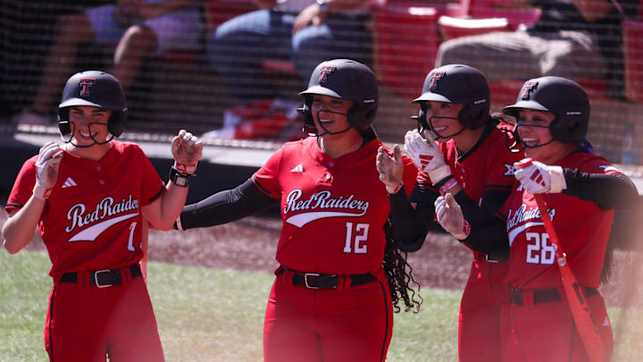 Texas Tech players, from left, Logan Halleman, Jasmyn Burns, Makayla Garcia and Angelyna Conde wait to greet Lauren Allred after a home run against Texas A&M-Corpus Christi during a Division I non-conference softball game, Sunday, March 1, 2026, at Rocky Johnson Field.