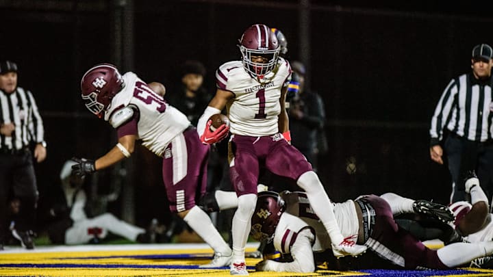 Harper Woods' Dakota Guerrant powers into the end zone during the Division 4 football district semifinal on Saturday, Nov. 2, 2024, at Bob Atkins Field.