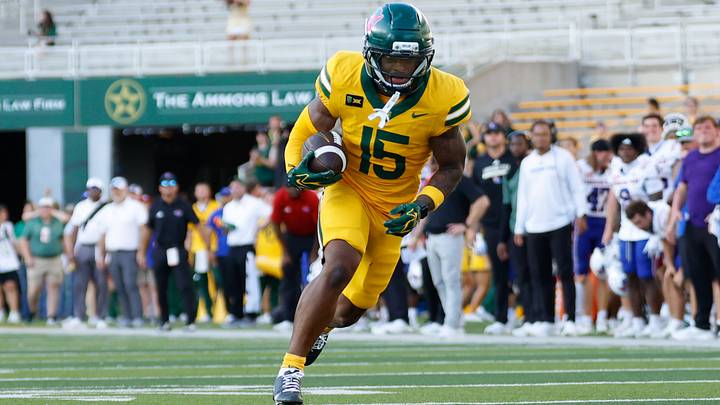 Sep 19, 2026; Waco, Texas, USA; Baylor Bears wide receiver Jayden McGowan (15) breaks away from Louisiana Tech Bulldogs defensive back Sam Fongang (1) on a touchdown reception during the second half at McLane Stadium. Mandatory Credit: Chris Jones Sep 19, 2026; Waco, Texas, USA; Baylor Bears wide receiver Jayden McGowan (15) breaks away from Louisiana Tech Bulldogs defensive back Sam Fongang (1) on a touchdown reception during the second half at McLane Stadium. Mandatory Credit: Chris Jones