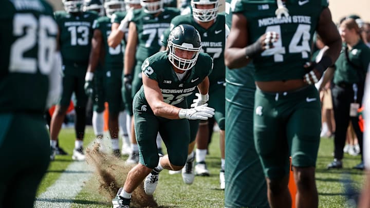 Michigan State defensive lineman James Schott (32) warms up before the Maryland game at Spartan Stadium in East Lansing on Saturday, Sept. 23, 2023.