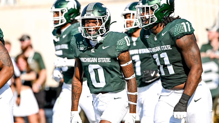 Michigan State's Charles Brantley, left, celebrates with Ken Talley after an interception against Prairie View A&M during the second quarter on Saturday, Sept. 14, 2024, at Spartan Stadium in East Lansing. Brantley's interception was called back on a penalty.