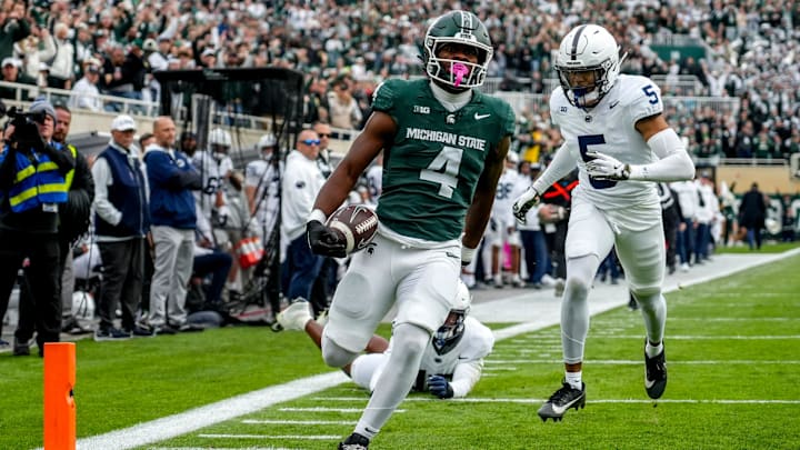 Michigan State's Elijah Tau-Tolliver runs for a touchdown against Penn State during the first quarter on Saturday, Nov. 15, 2025, at Spartan Stadium in East Lansing.