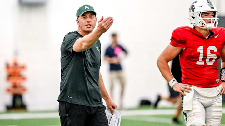 Michigan State's offensive coordinator Brian Lindgren works with the team during camp on Monday, Aug. 5, 2024, at the indoor practice facility in East Lansing.