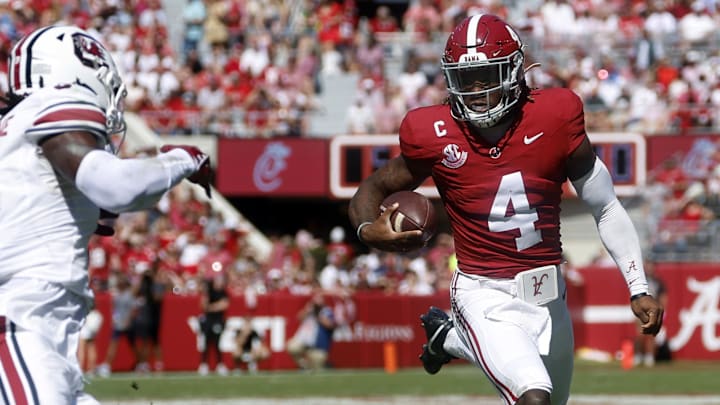 Oct 12, 2024; Tuscaloosa, Alabama, USA;  Alabama Crimson Tide quarterback Jalen Milroe (4) carries the ball against the South Carolina Gamecocks during the first half at Bryant-Denny Stadium. Mandatory Credit: Butch Dill-Imagn Images