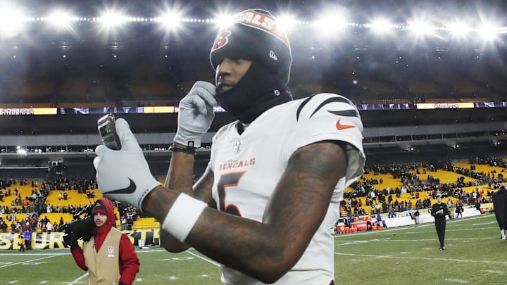 Jan 4, 2025; Pittsburgh, Pennsylvania, USA;  Cincinnati Bengals wide receiver Tee Higgins (5) goes live on social media after defeating the Pittsburgh Steelers at Acrisure Stadium. Mandatory Credit: Charles LeClaire-Imagn Images