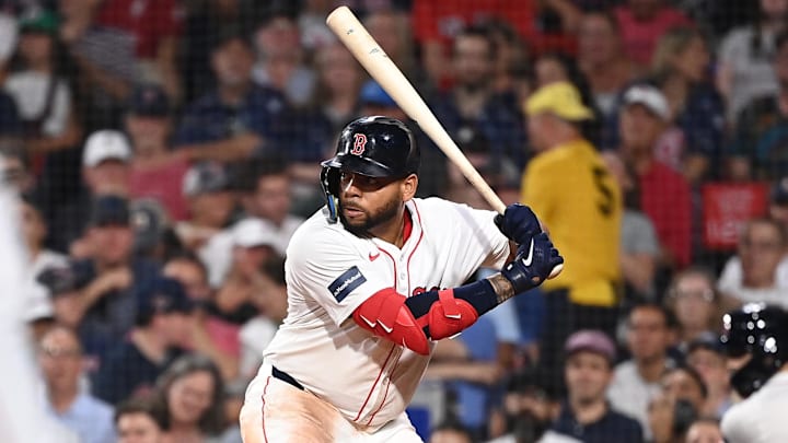 Jul 30, 2024; Boston, Massachusetts, USA; Boston Red Sox first baseman Dominic Smith (2) hits an RBI single against the Seattle Mariners during the seventh inning at Fenway Park.