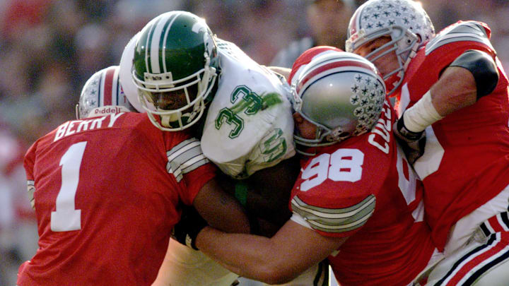 Nov. 7, 1998; Columbus, OH, USA; Ohio State vs. Michigan State - played in Ohio Stadium-OSU lost. MSU running back #33 Sedrick Irvin is sandwiched between Gary Berry and #98 Mike Collins in 1st Qtr; Mandatory credit: Lisa Finger-USA TODAY NETWORK via Imagn Images Nov. 7, 1998; Columbus, OH, USA; Ohio State vs. Michigan State - played in Ohio Stadium-OSU lost. MSU running back #33 Sedrick Irvin is sandwiched between Gary Berry and #98 Mike Collins in 1st Qtr; Mandatory credit: Lisa Finger-USA TODAY NETWORK via Imagn Images