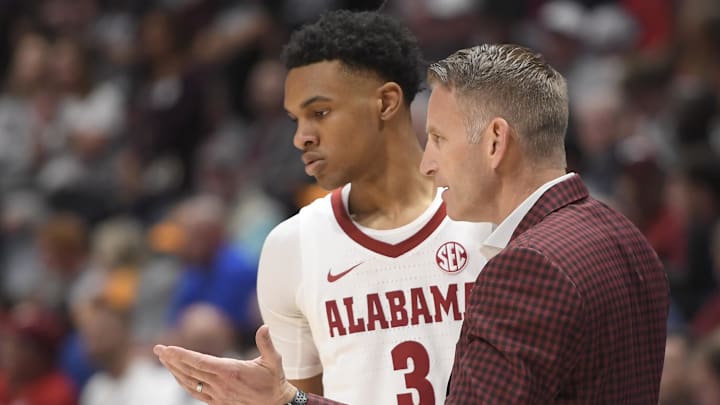 Mar 10, 2023; Nashville, TN, USA;  Alabama Crimson Tide head coach Nate Oats talks with guard Rylan Griffen (3) against the Mississippi State Bulldogs during the  second half at Bridgestone Arena. Mandatory Credit: Steve Roberts-Imagn Images