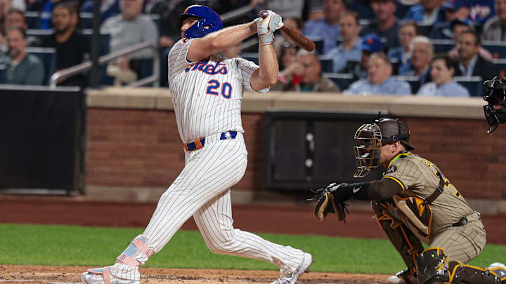 Sep 16, 2025; New York City, New York, USA; New York Mets first baseman Pete Alonso (20) hits a solo home run during the second inning against the San Diego Padres at Citi Field. Mandatory Credit: Vincent Carchietta-Imagn Images