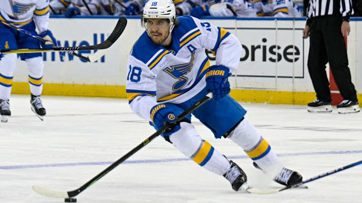 Nov 24, 2025; New York, New York, USA; St. Louis Blues center Robert Thomas (18) skates with the puck against the New York Rangers during the third period at Madison Square Garden. Mandatory Credit: Dennis Schneidler-Imagn Images
