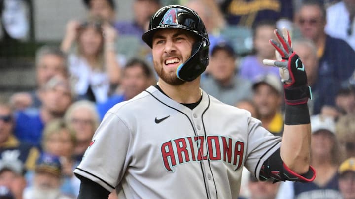 Aug 28, 2025; Milwaukee, Wisconsin, USA; Arizona Diamondbacks first baseman Tyler Locklear (28) reacts after getting hit by a pitch from Milwaukee Brewers starting pitcher Jose Quintana (not pictured) forcing in a run in the second inning at American Family Field. Mandatory Credit: Benny Sieu-Imagn Images